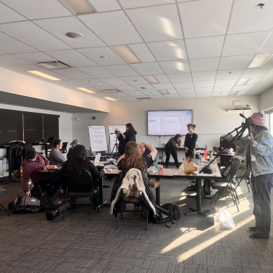 NJTI's 2025 community journalism training cohort unpacking their media kits and practising setting up their gear. Photo: NJTI