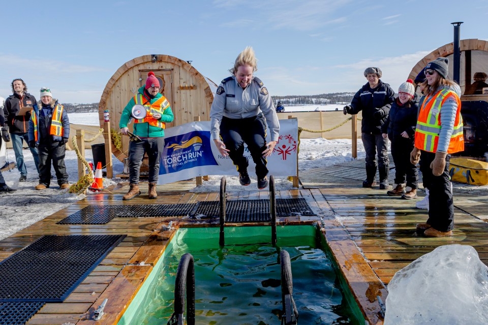 Cpl April Gavel of NWT RCMP gained the most height on entry during the 2025 Polar Plunge. Photo: Val Pond Photography