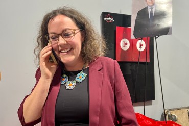 Rebecca Alty takes a call after declaring victory at her election night party on April 28, 2025. Emily Blake/Cabin Radio
