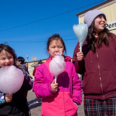 Westlyn Takazo,5, Azalea Takazo,7 and Bella Louison, 11, cotton candy. Photo: Bill Braden