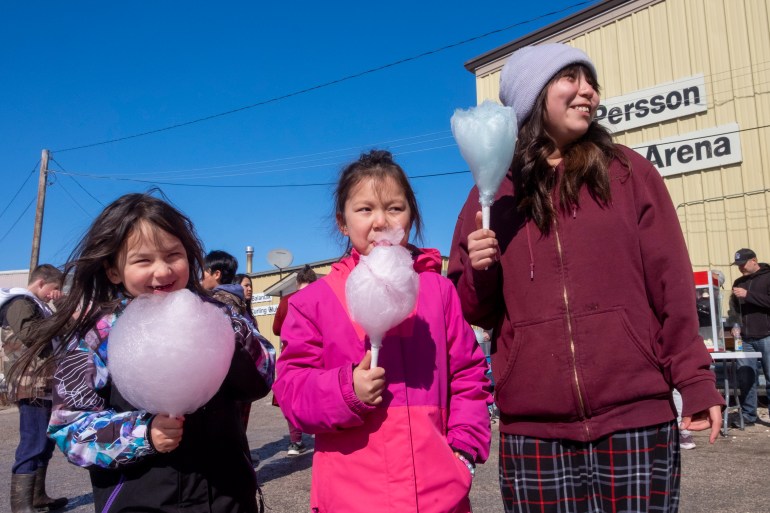 Westlyn Takazo,5, Azalea Takazo,7 and Bella Louison, 11, cotton candy. Photo: Bill Braden