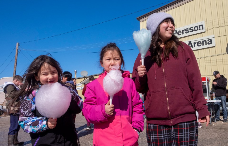 Westlyn Takazo,5, Azalea Takazo,7 and Bella Louison, 11, cotton candy. Photo: Bill Braden