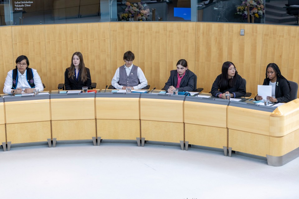 Peter Mahon and Jack Penney, centre, during Youth Parliament on May 1, 2025. Ollie Williams/Cabin Radio