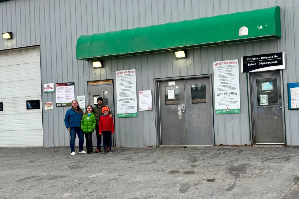 Jane Ann Swim and family outside The Bottle Shop. Photo: Submitted