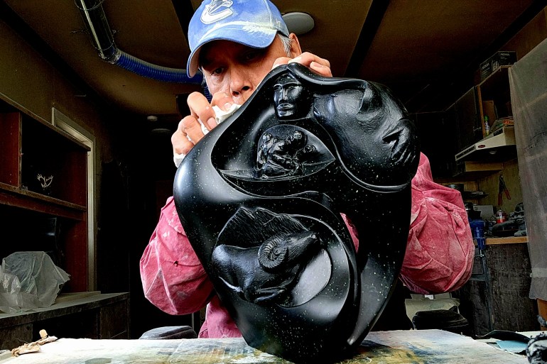 John Sabourin working on a carving - John Sabourin