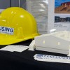 Items on display at a Housing NWT booth during the 2025 Arctic Development Expo in Inuvik. Ollie Williams/Cabin Radio