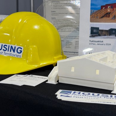 Items on display at a Housing NWT booth during the 2025 Arctic Development Expo in Inuvik. Ollie Williams/Cabin Radio