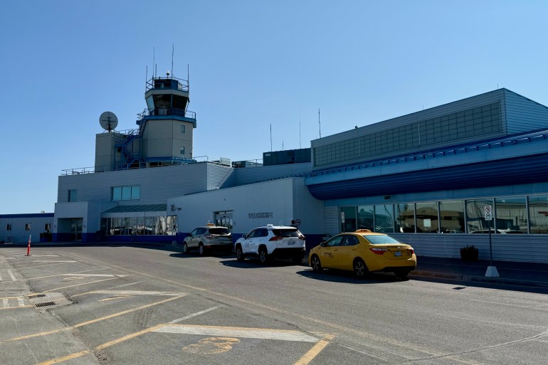 Taxis outside Yellowknife Airport in June 2025. Ollie Williams/Cabin Radio