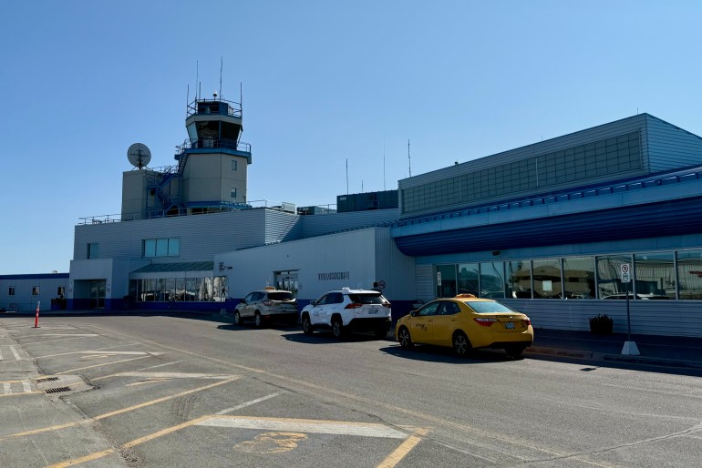 Taxis outside Yellowknife Airport in June 2025. Ollie Williams/Cabin Radio