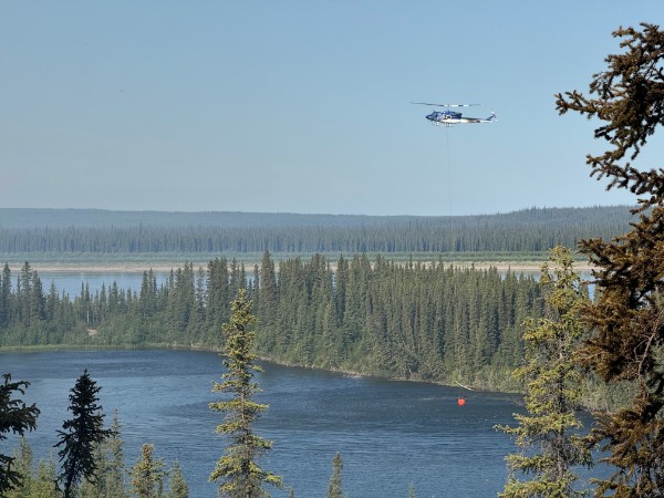 Tom buckets the Fort Good Hope culture camp. Photo: Submitted