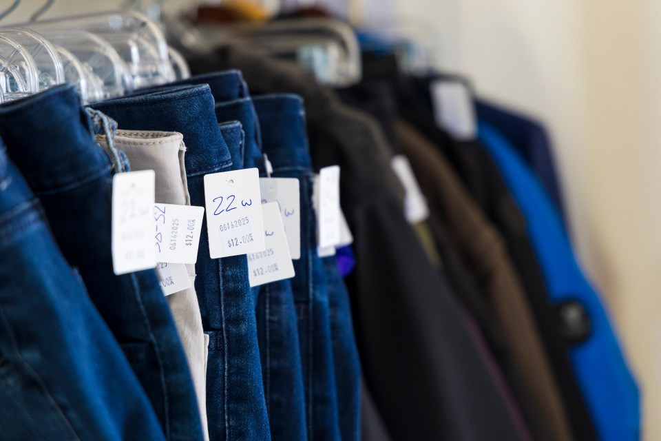 Price tags on clothing hanging up at Next to New. Ollie Williams/Cabin Radio
