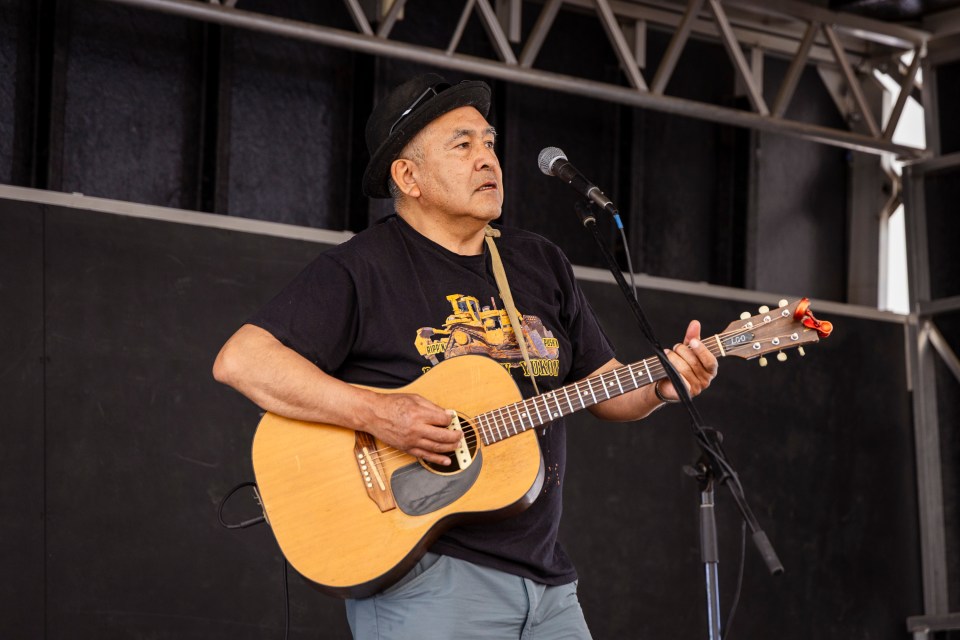Dennis Allen performs during Inuvik's 2025 National Indigenous Peoples Day celebrations. Ollie Williams/Cabin Radio