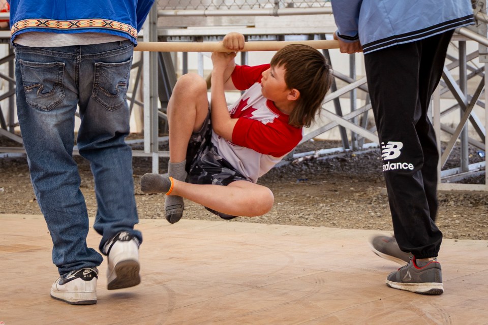 A young contender in an Arctic Games demonstration. Ollie Williams/Cabin Radio