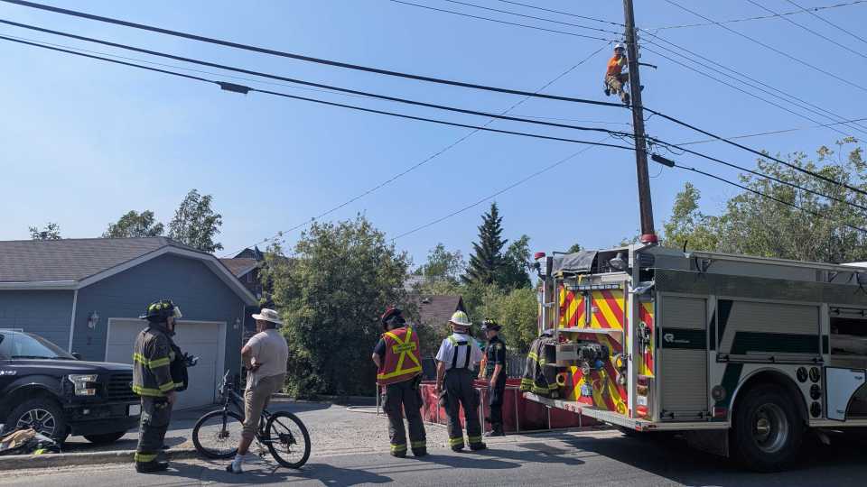 Firefighters and residents on Latham Island. Sarah Pruys/Cabin Radio