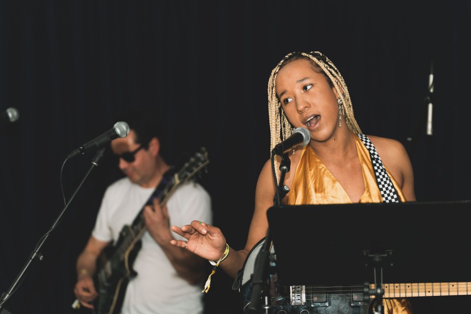 Anica, who only recently began learning guitar, sings a mashup song. Sarah Pruys/Cabin Radio