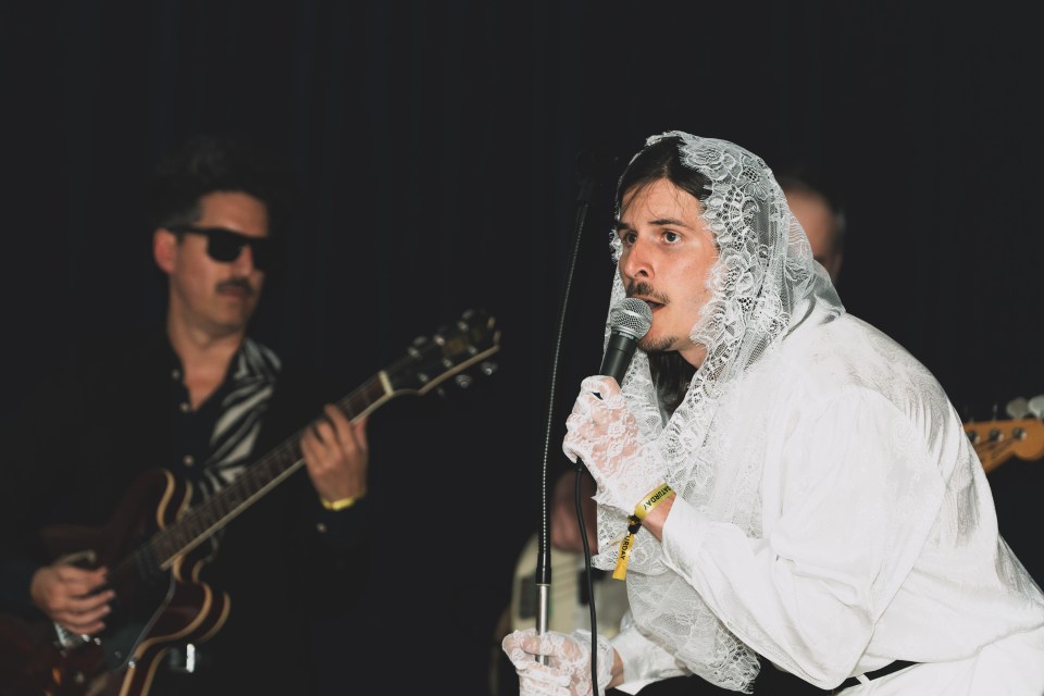 Taylor saracuse, of taylor saracuse and some other dead people, sings his first song as the last act of the night. Sarah Pruys/Cabin Radio