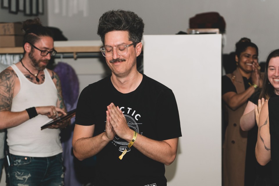 Peter Adourian walks to the front of the room after his band, HYFY, was named the winner of the 2025 Main Stage Showdown. Sarah Pruys/Cabin Radio