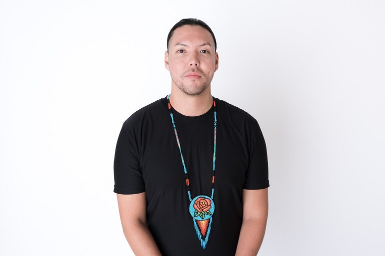 Matthew Vukson is shown wearing his hand-beaded art in a photo published to Facebook by the Prince of Wales Northern Heritage Centre.