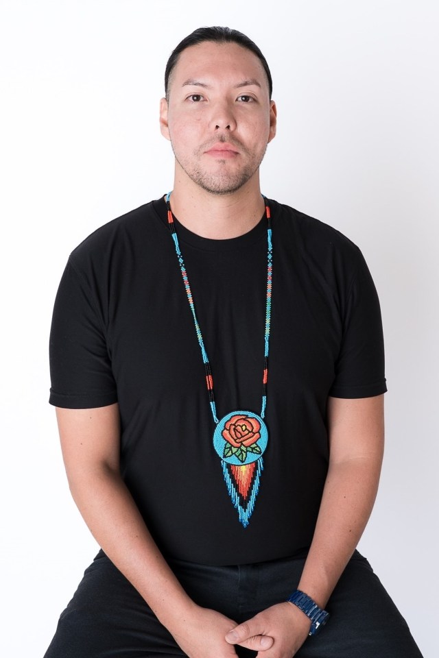 Matthew Vukson is shown wearing his hand-beaded art in a photo published to Facebook by the Prince of Wales Northern Heritage Centre.