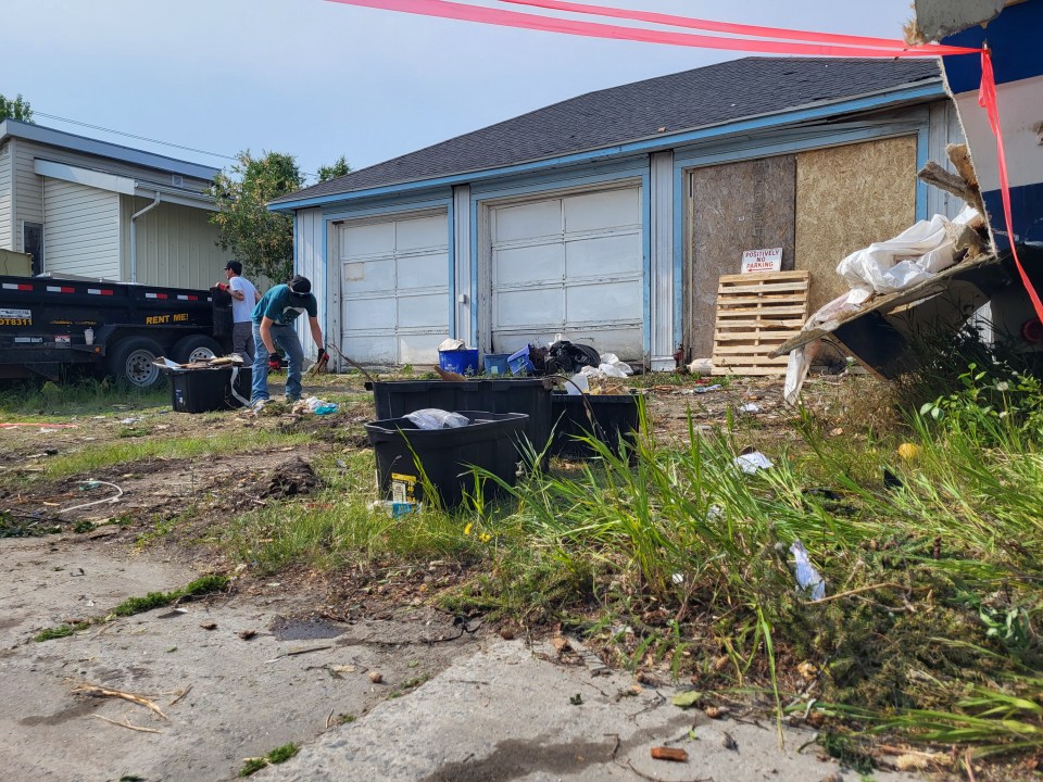 Workers clean up the explosion site on 54 Street. Serra Hamilton/Cabin Radio