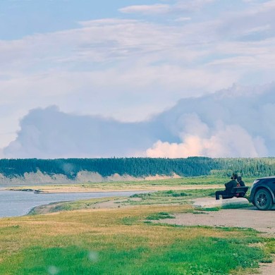 Wildfire FS014 is seen east of Fort Simpson on July 25, 2025. Photo: Lynn Canney