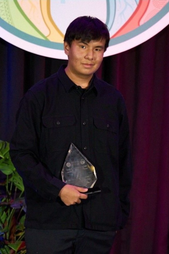 Damon McAllister is seen with the Nelson Mayer Award in a photo published by the National Association of Friendship Centres.