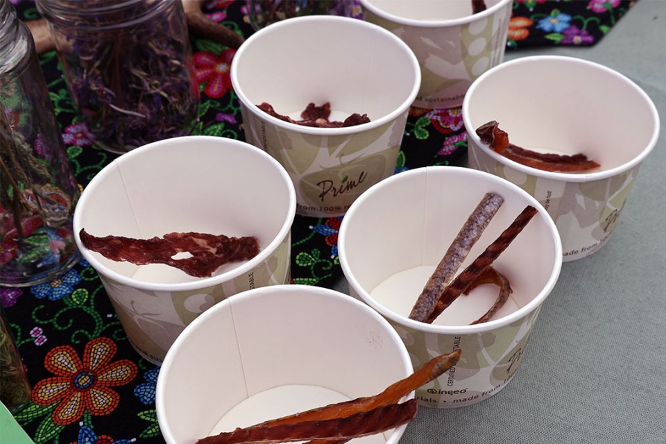 Containers of smoked trout and beef sticks displayed side-by-side.