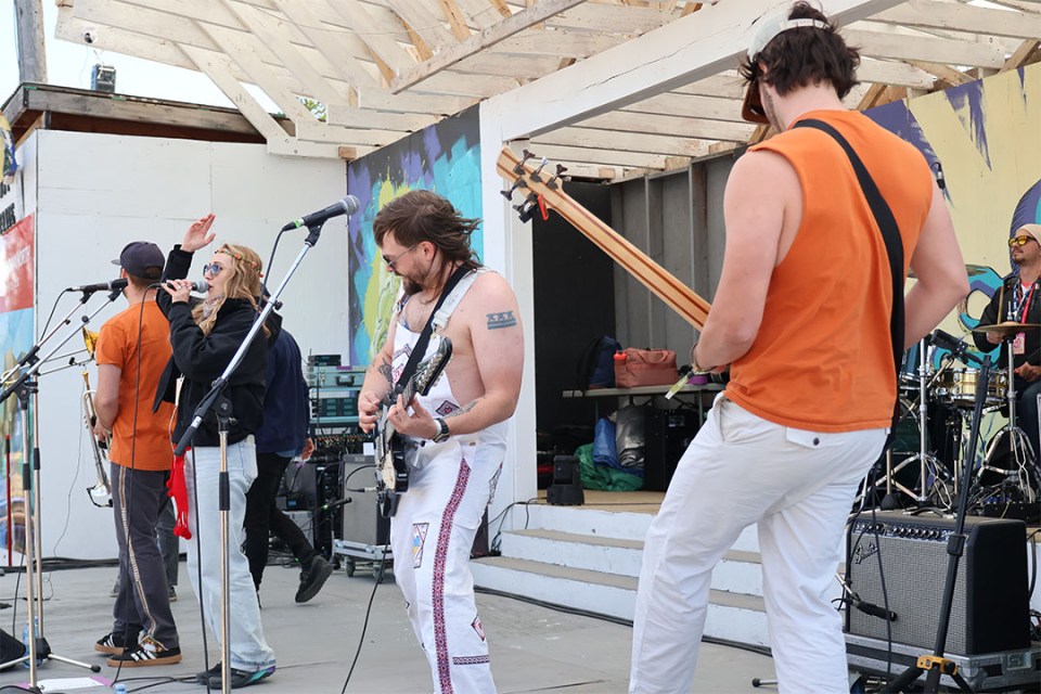 Band performs on stage.