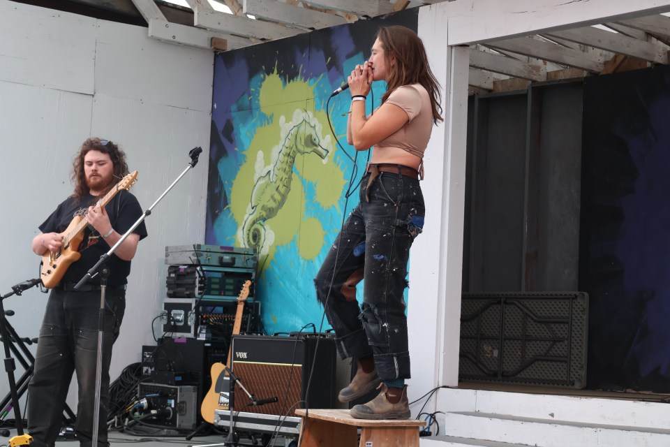 HYFY, led by vocalist Cat McGurk, were on stage when the storm moved in. Aastha Sethi/Cabin Radio