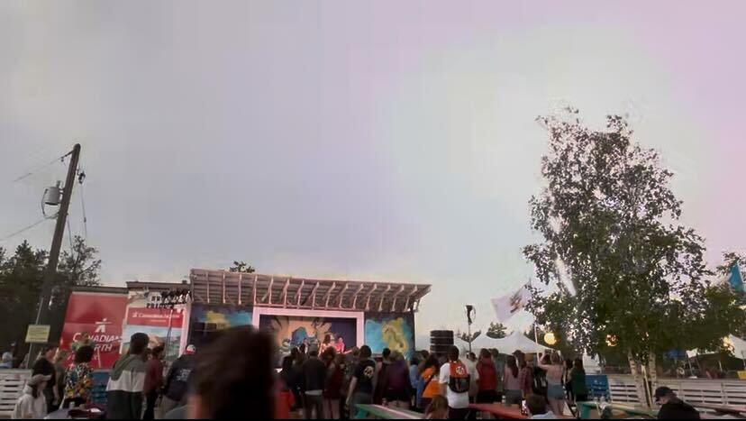 The sky is illuminated by a lightning flash during HYFY's set. Ehxea Antoine/Cabin Radio