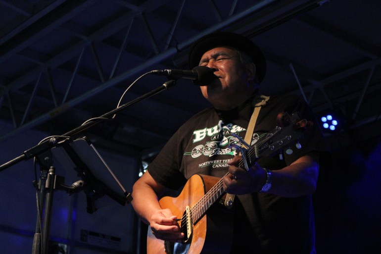Dennis Allen during an open-mic session at the 2025 Great Northern Arts Festival. Serra Hamilton/Cabin Radio
