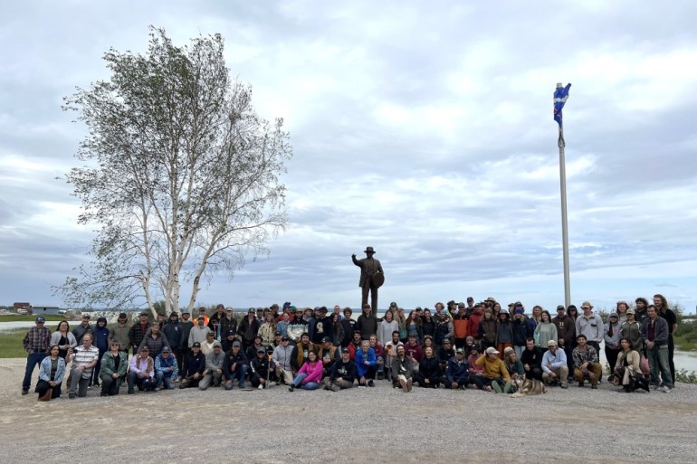 A group photo at a reforestation project celebration in Behchokǫ̀ in 2025. Emily Blake/Cabin Radio