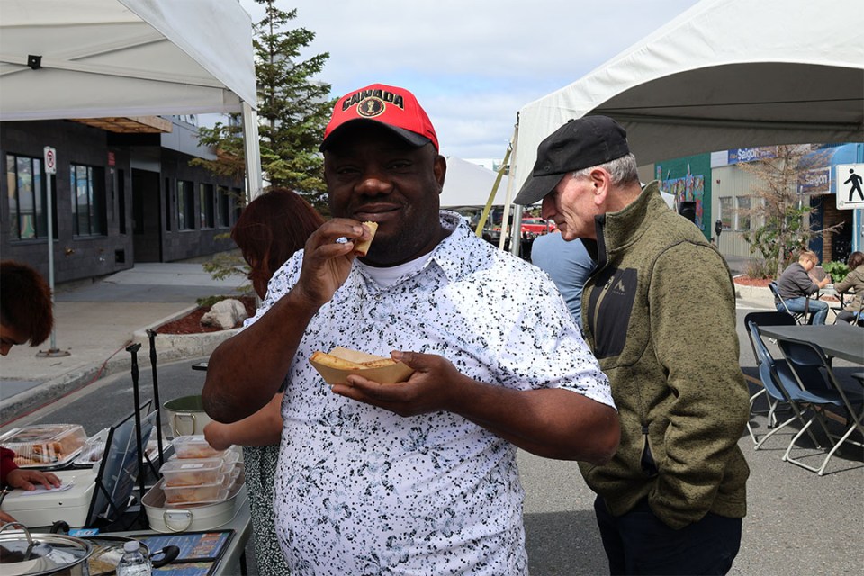 Man about to eat a spring roll