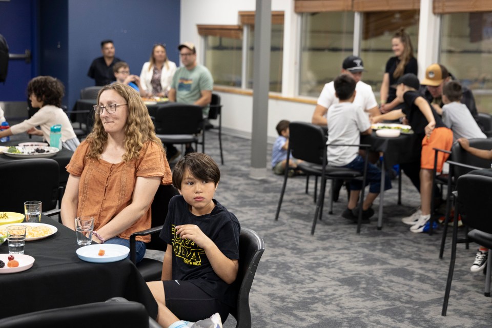 Families await the prime minister inside Fort Smith's community centre. Ollie Williams/Cabin Radio