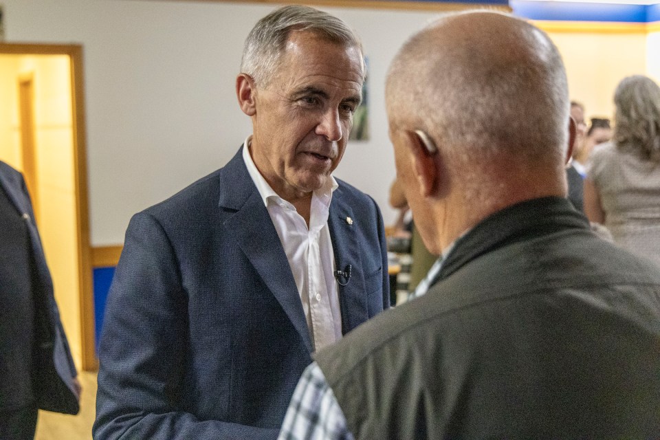 Mark Carney meets former NWT finance minister Michael Miltenberger. Ollie Williams/Cabin Radio