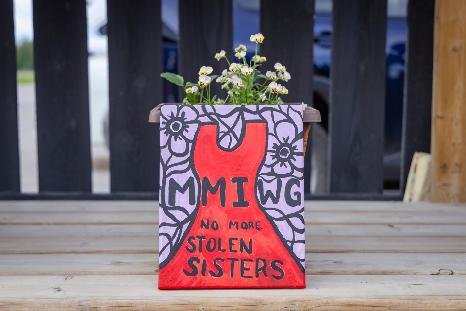 A painting at Hay River's youth centre depicts MMIWG and urges "no more stolen sisters." Ollie Williams/Cabin Radio
