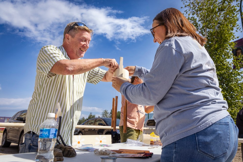 NTPC staff build their wind chimes for the corporate art attack. Ollie Williams/Cabin Radio