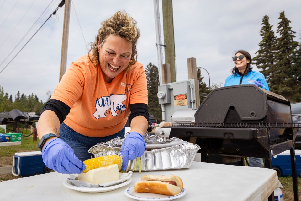 A piece of corn is exuberantly drowned in butter at Hay Days. Ollie Williams/Cabin Radio
