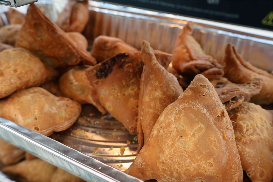 Metal tray of samosas