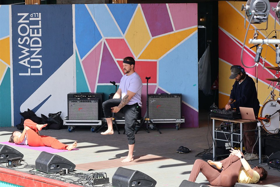 Yoga demonstration on stage.