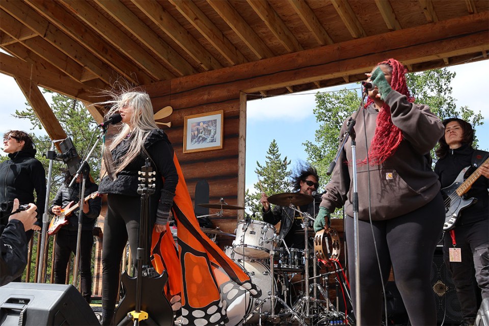 6 members of a band perform on stage