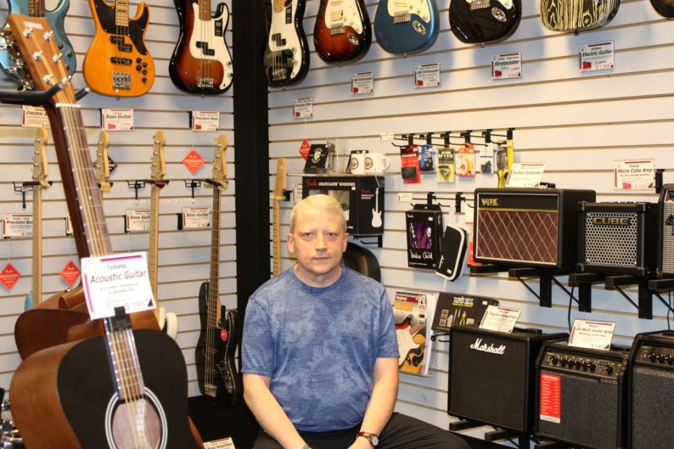 Jim White, owner, in the Fiddles & Stix Music Store - Sara Verheul
