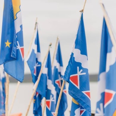 A photo of Tłı̨chǫ flags during a Trails of Our Ancestors trip published by the Tłı̨chǫ Government in 2024.