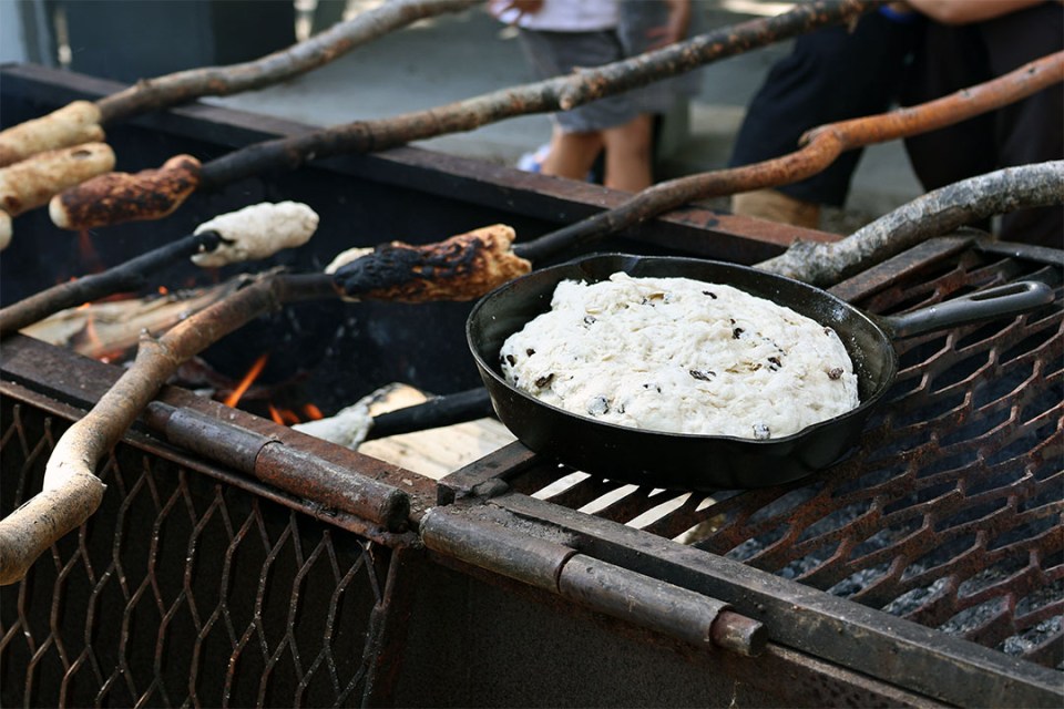 Making bannock over a fire