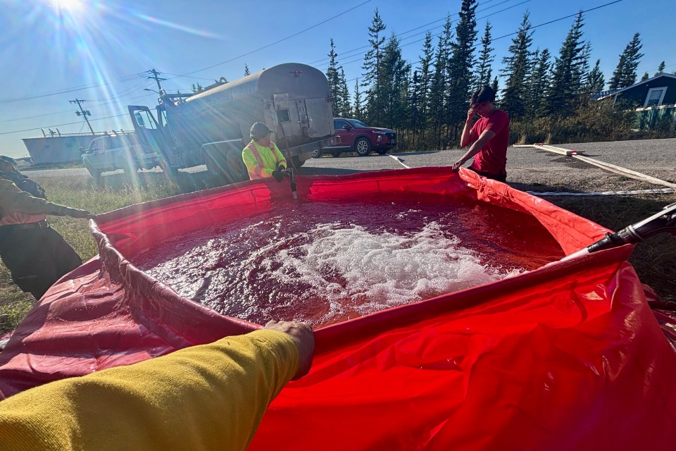 Firefighters make preparation to protect Whatì against wildfire ZF048. Mike Westwick/GNWT