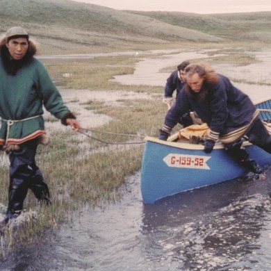 Peter Esau, left, guides Garner King and Bob Knights into Fish Lake, Sachs Harbour, in 1958. NWT Archives/N-1993-002:0277
