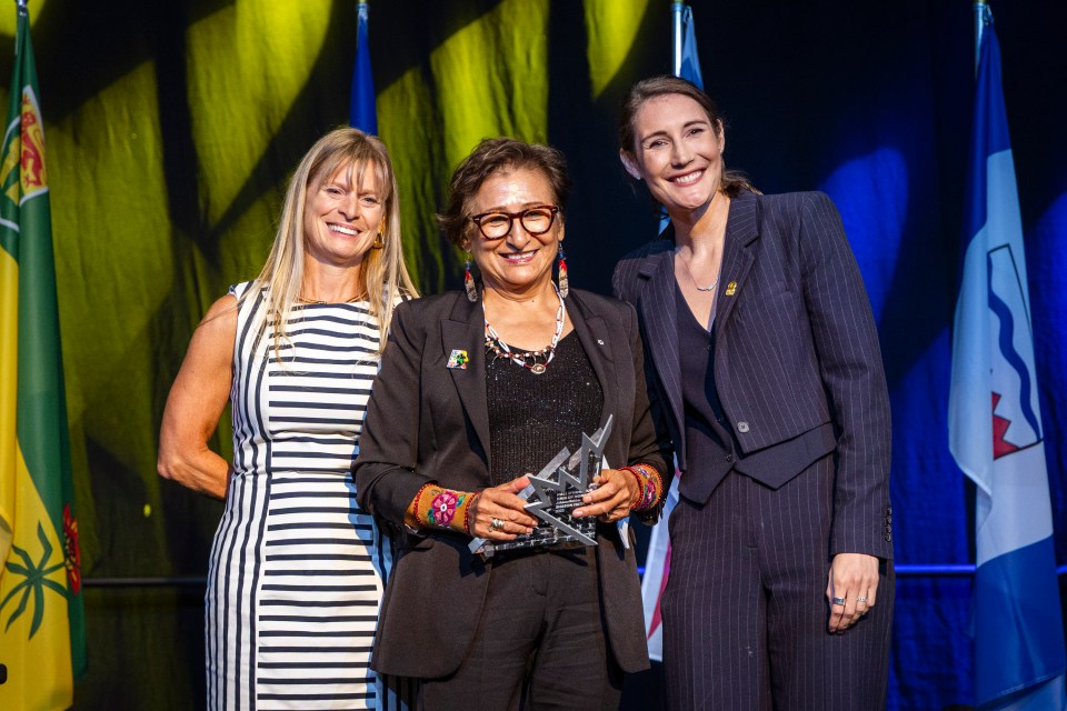 Sharon Firth, centre, attends her formal induction at a Canada Games Hall of Honour ceremony on August 8, 2025. Ollie Williams/Team NT