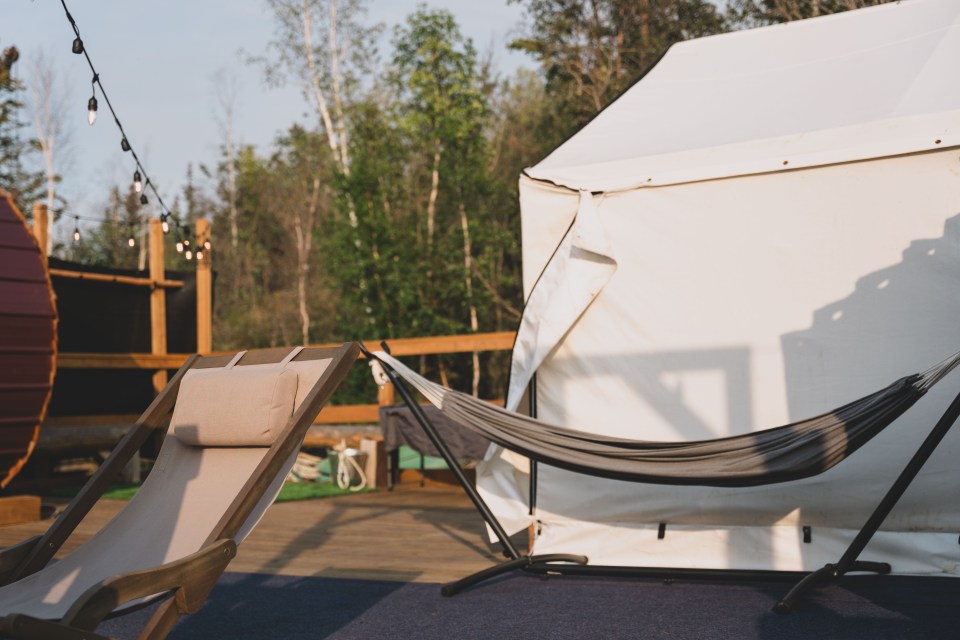 String lights and patio chairs abound aboard the barge. Sarah Pruys/Cabin Radio
