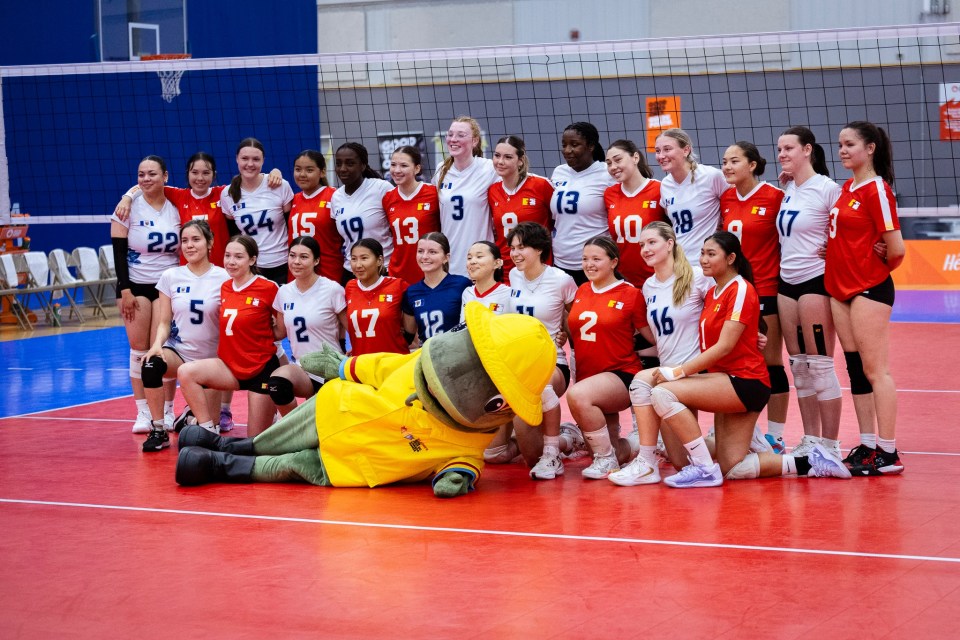 Gusty, the sou-wester-sporting codfish who served as the 2025 Canada Games mascot, joined Nunavut and NWT volleyball players for a photo.