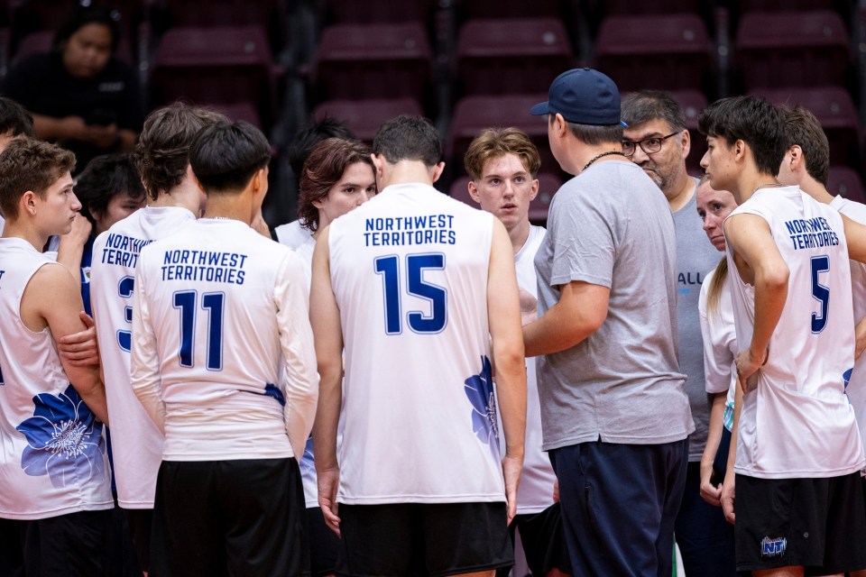 Alongside about 130 athletes, more than 50 coaches, team managers and mission staff – people who help the team run smoothly and handle logistics – made the trip to St John's. Here, volleyball coaches Brandon Thompson, Dave Heron and Heather Coakwell work with the male team during a break in play.